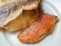 Peeled sun-creamfish with delicious caviar lies on a white plate