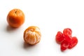 Peeled tangerine or mandarin fruit and candied orange fruit isolated on white background Royalty Free Stock Photo