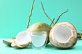 Peeled young coconut fruit and glass of coconut water