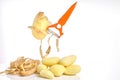 Peeler cleans potatoes, potato skin and peeled potatoes on a white background, place for text Royalty Free Stock Photo