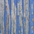 Peeling blue paint on wooden door or fence Royalty Free Stock Photo