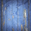 Peeling blue paint on wooden door or fence Royalty Free Stock Photo