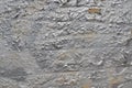 Peeling cracked graffiti paint of silver color on concrete wall Royalty Free Stock Photo