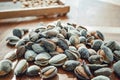 Peeling fresh almonds on an outdoor table in a sunny summer day. Home grown bio  food, farm life, country life Royalty Free Stock Photo