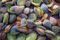 Peeling fresh almonds on an outdoor table in a sunny summer day. Home grown bio  food, farm life, country life Royalty Free Stock Photo