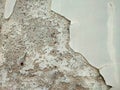 A peeling light gray plastered wall Royalty Free Stock Photo