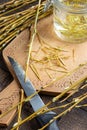 Peeling off bark from white willow branches to prepare tincture Royalty Free Stock Photo