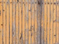 Orange wooden plank wall with peeling paint