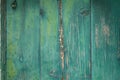 Weathered paint in blue hues on the wooden planks of an old timber door Royalty Free Stock Photo