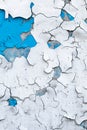 Peeling paint on old concrete wall. Cracked plaster, flaky stucco. Blue and white painted abstract background, grunge surface, Royalty Free Stock Photo