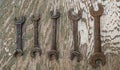 Old set of rusty dirty metal tools on a peeling paint plywood Royalty Free Stock Photo