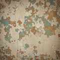 Peeling paint on a textured wall creates an abstract pattern. Layers Royalty Free Stock Photo