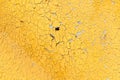 Peeling paint on wall seamless texture. Pattern of rustic yellow grunge material. Royalty Free Stock Photo