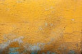 Peeling paint on wall seamless texture. Pattern of rustic yellow grunge material. Royalty Free Stock Photo