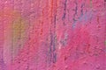 Peeling pink graffiti paint on concrete wall Royalty Free Stock Photo