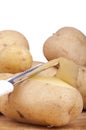 Peeling potatoes Royalty Free Stock Photo