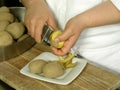 Peeling potatoes Royalty Free Stock Photo