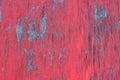 Peeling red paint on a wooden surface, creative background Royalty Free Stock Photo