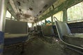 Peeling seats inside abandoned trolley car