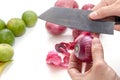 Peeling shallots beside with limes, prepare for cooking Royalty Free Stock Photo