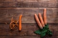 Peeling vegetables - carrots and potatoes on wooden board - stud