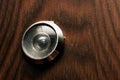 Peephole at the door with a wooden texture Royalty Free Stock Photo