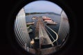 Peephole view of a small port with boats in the water