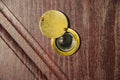 Peephole on wooden door - judas hole spyhole