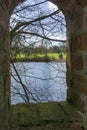 Peeping through a brick archway into view of the countryside