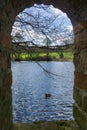 Peeping through a brick archway into view of the countryside