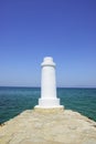 Pefkohori, Kassandra, Chalkidiki, Halkidiki, Greece. Lighthouse on the end of a pier in the Aegean Sea