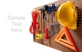 Peg board with tools and hard hat