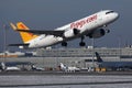 Pegasus Airbus plane taking off from the airport, snow on runway