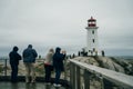 Peggy& x27;s Cove Light House in Nova Scotia with people - oct 2022 Royalty Free Stock Photo