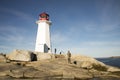 Tourists at Peggys Cove Lighthouse, Nova Scotia, Canada Royalty Free Stock Photo
