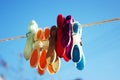 Pegs on washing line with blue sky background Royalty Free Stock Photo