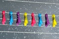 Pegs on a washing line in the rain Royalty Free Stock Photo