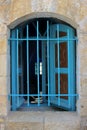 Open window of a synagogue with blue shutters Peki`in, a Druze village in the northern district of Israel.