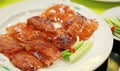 Peking Duck - Chinese roast duck served with cucumber, spring onion and hoisin sauce, wrapped in pancakes Royalty Free Stock Photo