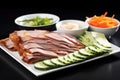 peking duck with cucumber and carrot slices