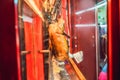 Peking duck is roasting in the oven, preparing to serve on the cost Royalty Free Stock Photo