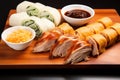 peking duck whole, sliced, and as a roll in a trio