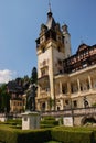 Peles Castle with King Carol I Statue Royalty Free Stock Photo