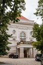 Pelhrimov, Czech Republic, 03 July 2021: Lubomir Lipsky Theater near Renaissance castle with red facade, narrow picturesque street