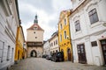 Pelhrimov, Czech Republic, 03 July 2021: Upper or Rynarecka gate, Medieval renaissance clock tower, narrow picturesque street with