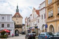 Pelhrimov, Czech Republic, 03 July 2021: Upper or Rynarecka gate, Medieval renaissance clock tower, narrow picturesque street with