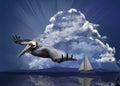 A pelican flees an approaching storm in an ocean scene with a sailboat and threatening sky background. Royalty Free Stock Photo