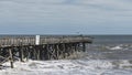 Pelican Inspecting the Damage to the Fishing Pier