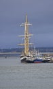 The Pelican of London a Class A Tall Ship alongside the quay at the Port of Montrose with the Road and Rail Bridges behind. Royalty Free Stock Photo