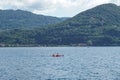 Pella - 07/12/2020: red canoe in Orta`s lake Royalty Free Stock Photo